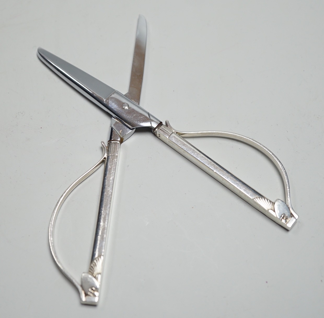 A late 1950's pair of Georg Jensen cactus pattern silver mounted grape shears, 14cm.